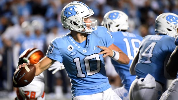 North Carolina Tar Heels quarterback Drake Maye attempts a pass during a college football game.